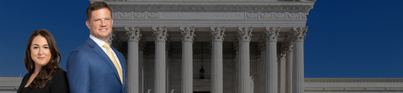 Group photo of Urbelis Law, LLC with the Supreme Court of Justice in the background